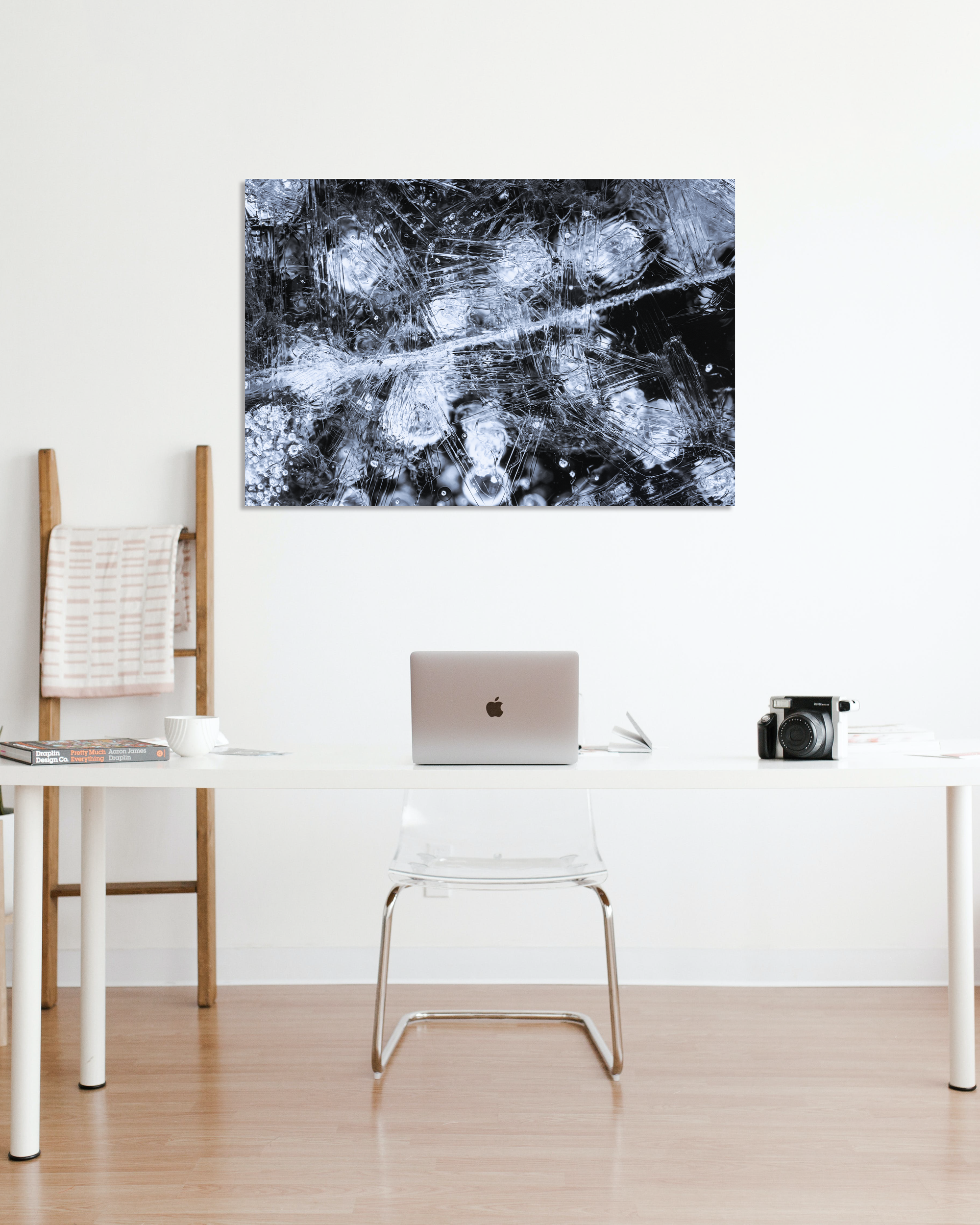 A photograph of microscopic frozen water hangs on an office wall.