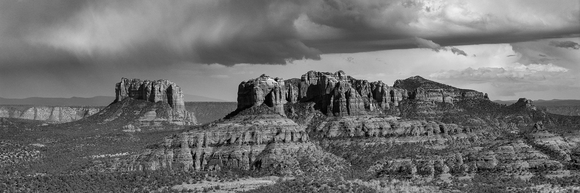 Desert mesas reach for a moody sky in the southwest.