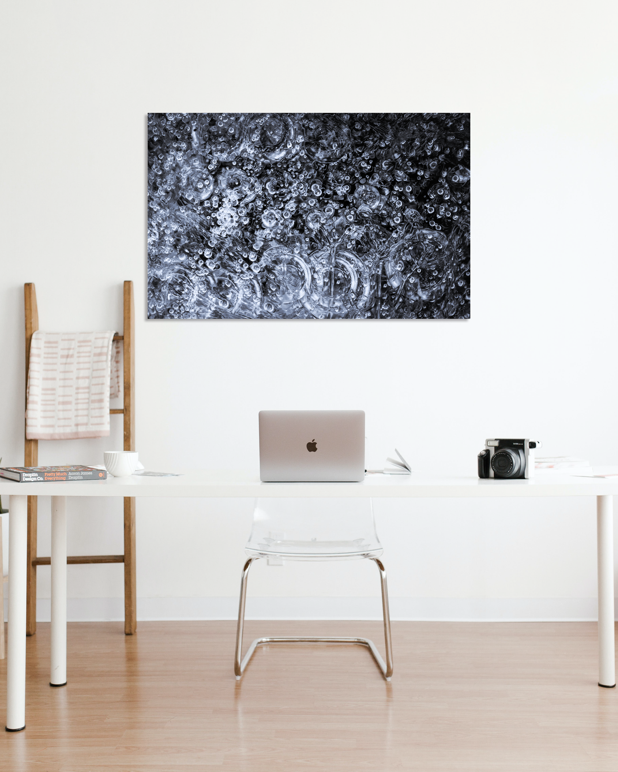 A fine arts photograph hangs on an office wall showcasing microscopic frozen water bubbles.