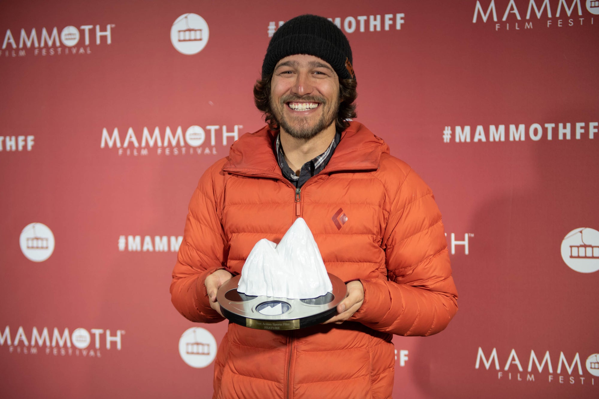 Nick Cahill holds an award he won at the Mammoth Film Festival.