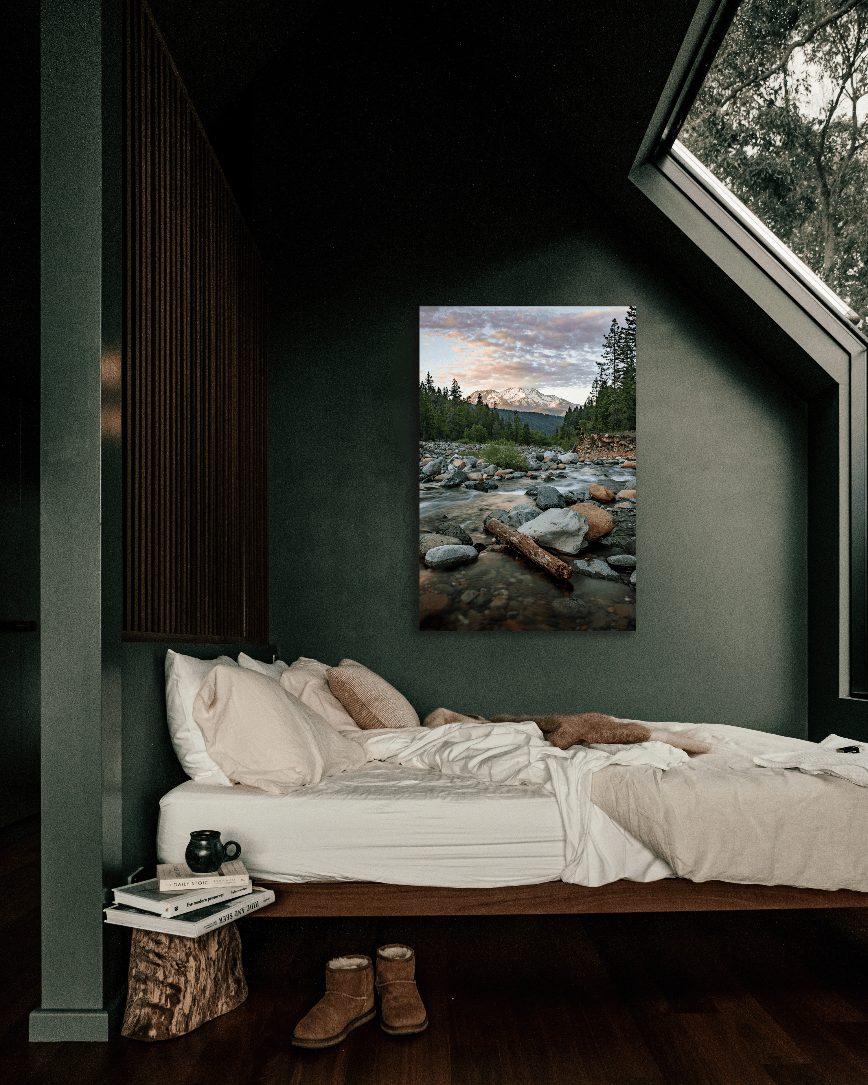 A bedroom wall decorated with a fine art photograph showcasing a mountain and mountain spring.