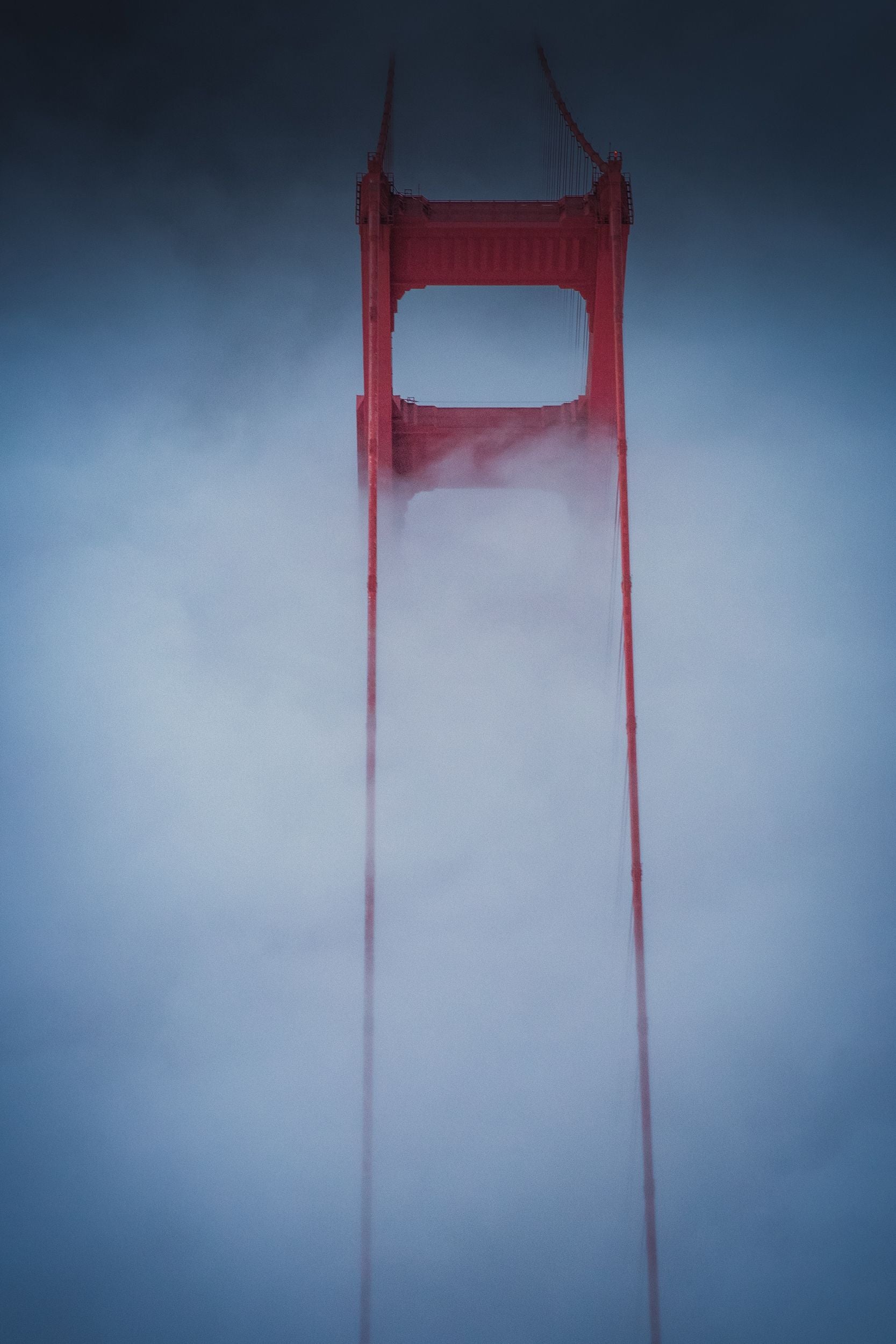 Fog drapes the Golden Gate Bridge.