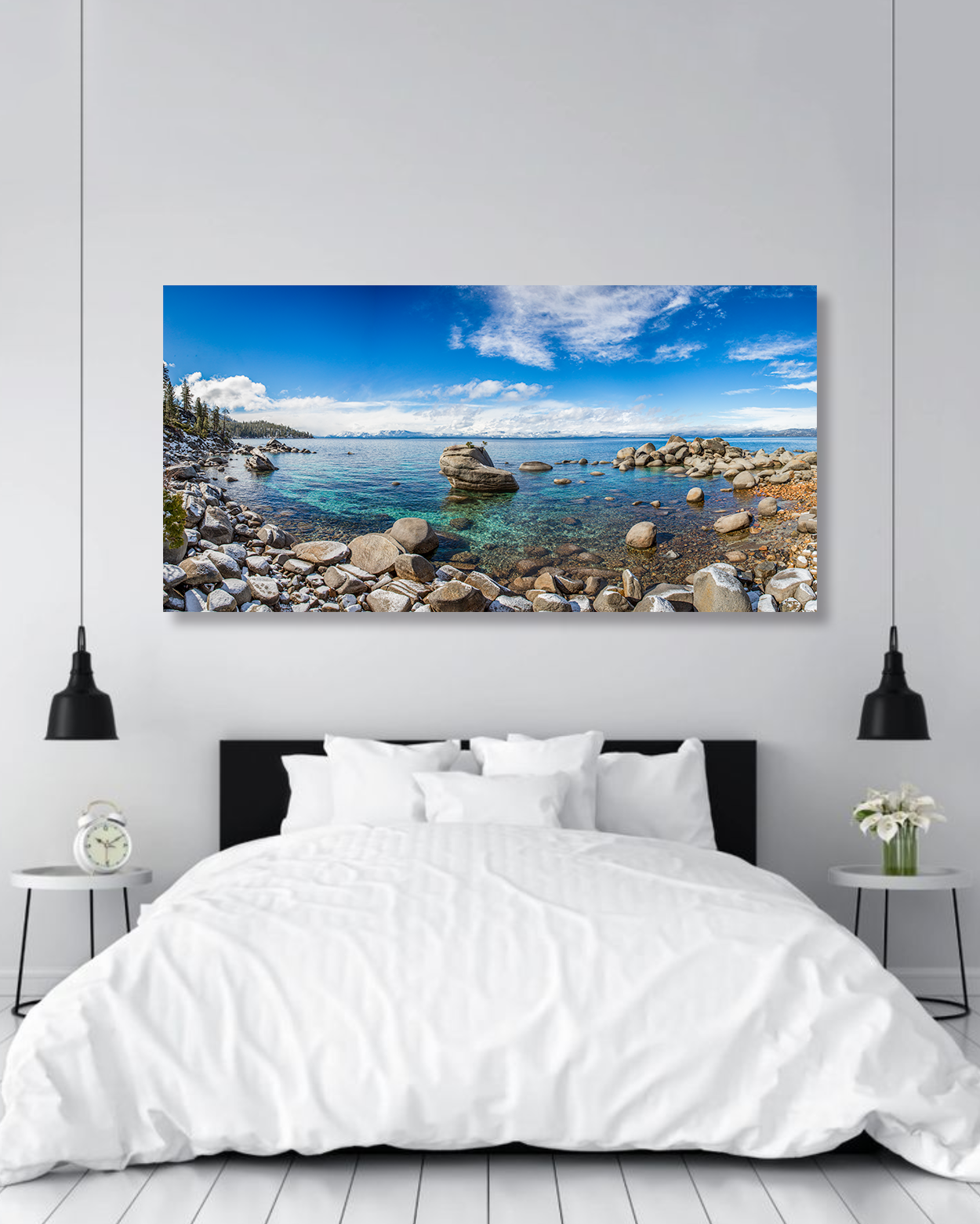 A photograph of Lake Tahoe hangs on the wall of a bedroom.