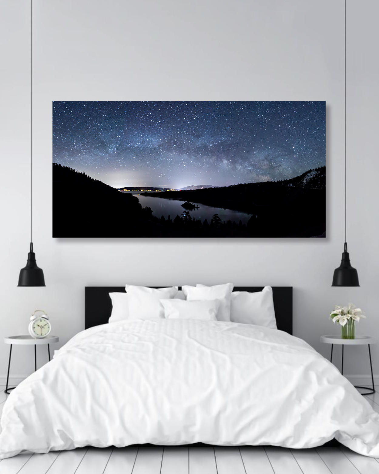 A large image of the Milky Way adorns the wall of a modern bedroom.