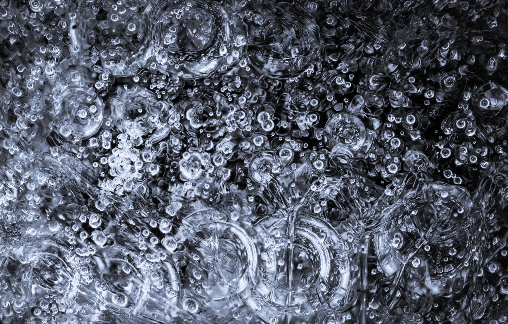 Frozen bubbles of water against a dark background.